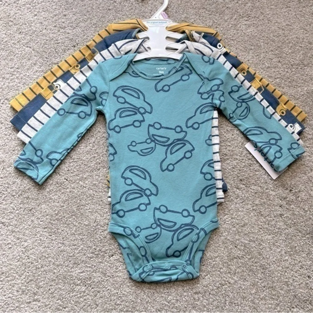 NWT Carter’s baby size 9 months four pc. Long sleeve onesies